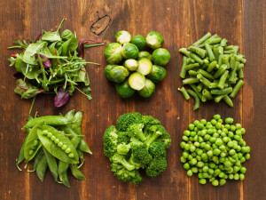 Different kinds of vegetables on the wooden background. Viewed from above.