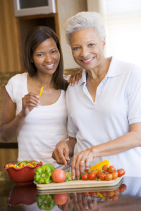 Mother And Daughter Preparing meal,mealtime Together